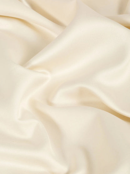 Cream-coloured king bedsheet